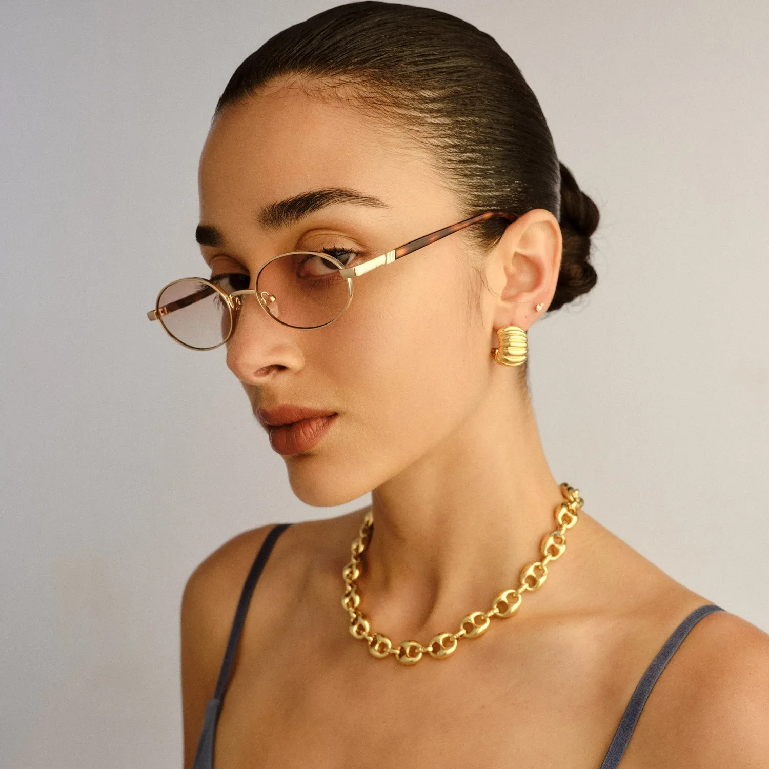 Le Specs Icicle occhiali da sole bright gold ovali